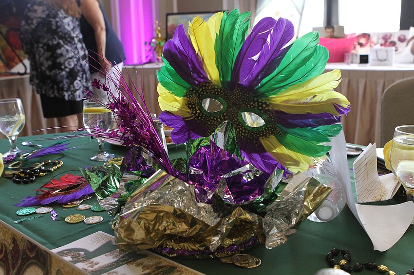 This year's event had unique Mardi Gras masks decorating the various tables.