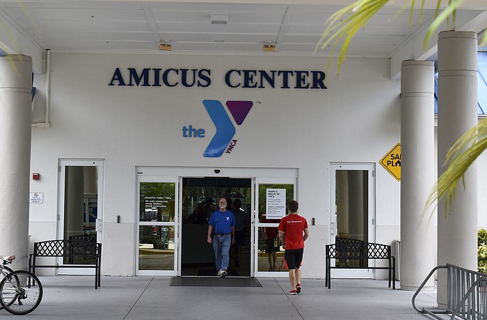 A patron walks out of the Frank G. Berlin, Sr. branch, one of the two branches closing. Whitney Elfstrom
