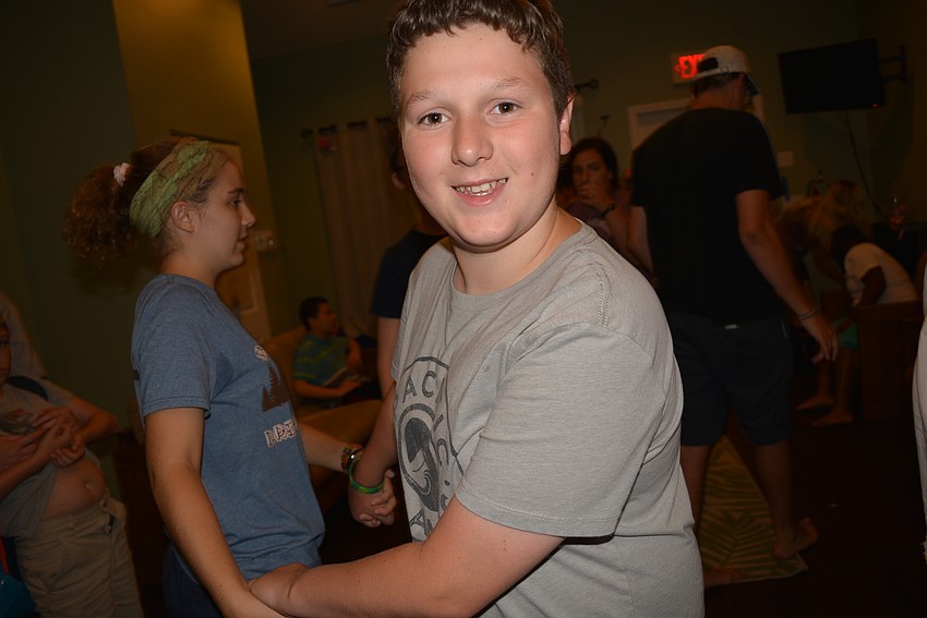 Buffalo Creek Middle School student Zack Tompkins, 12, has fun dancing with counselor Abby Klaben. Dancing with a friend is more fun than solo dancing, he says.