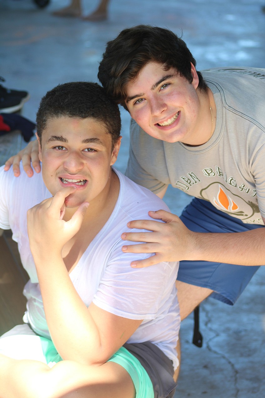 East County's Vivaldi Polanco poses with counselor Aidan Mendel, a Lakewood Ranch High School student, at the pool. Photo courtesy of Devonte Ousley.