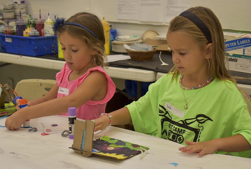 Marin Mitchell and Lyla Ochsendorf work on their Maya Lin architecture diorama.