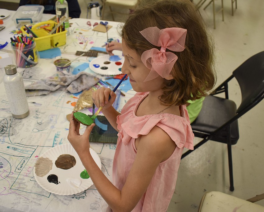 Nora Bent pants part of her diorama.