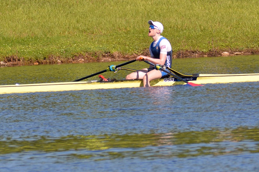 Samuel Melvin yells in victory after winning the lightweight men's single scull race at the 2019 World Rowing U23 Championships.