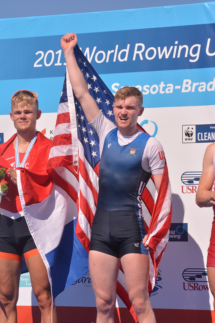Samuel Melvin raises the American flag high after winning the lightweight men's single scull race (7:06.67) at the 2019 World Rowing U23 Championships.