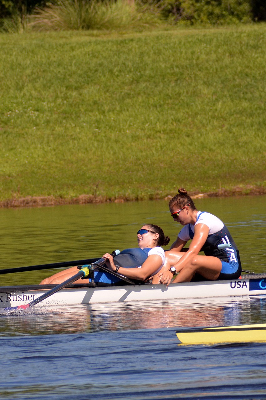 Teal Cohen and Chase Shipley collapse after helping the U.S. women's four take bronze (6:39.89).