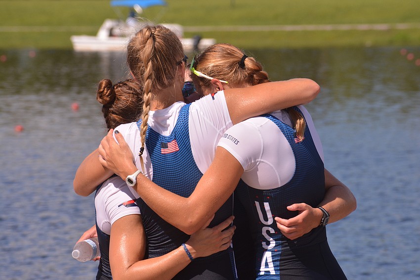 U.S. rowers Kaitlyn Kynast, Meredith Koenigsfeld, Teal Cohen and Chase Shipley embrace after winning bronze in the women's four.