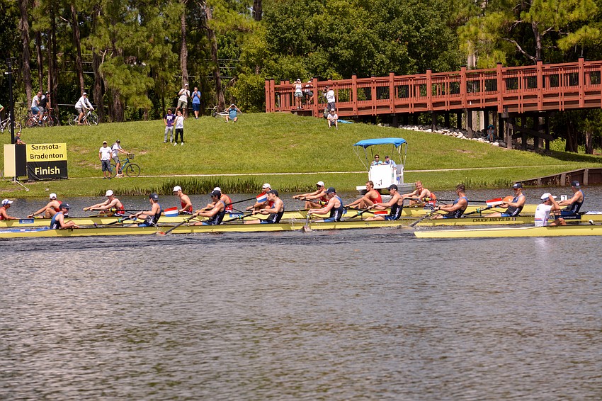 The U.S. (blue), Netherlands (red) and Great Britain (white) men's eight boats battle for medal position. The U.S. would finish third.
