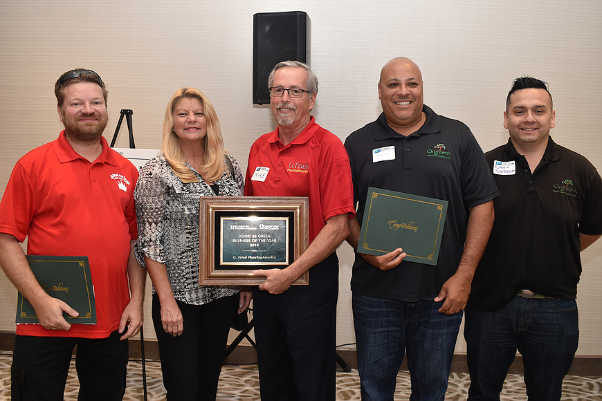 2018&#39;s Good as Green Business of the Year second place winner Tomas Jusak of Junk King, first place Jacci Shovlin and Mike Solmonson of G. Fried Flooring and third place winners Angel Cruz and Ruben Rod. Photo by Katie Johns