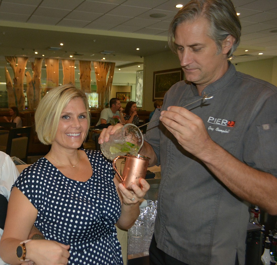 Shaina Swan checks out a Jalisco Mule, made by Grove GM and Executive Chef Greg Campbell, and which will be featured at the Celebrity Bartender Challenge.