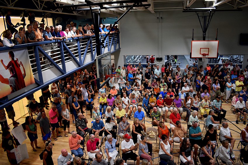 Members filled the gym floor and overflowed onto the mezzanine.