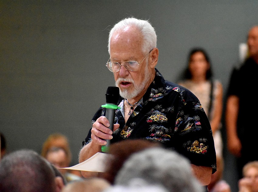 Jim Becherei, one of the founders of Save Our Y, led the town hall discussion.