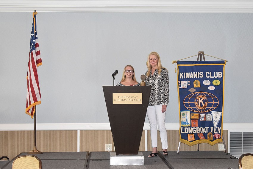 Summer Devlin stands next to Susan Phillips after accepting her award.