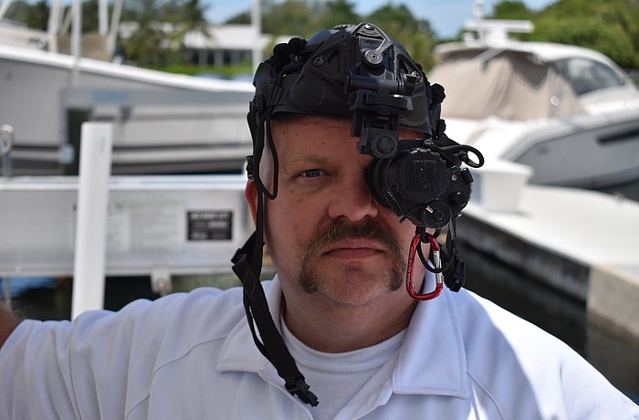 Lieutenant Brandon Desch shows off the Longboat Fire Department's night vision monocular. Photos by Sten Spinella.
