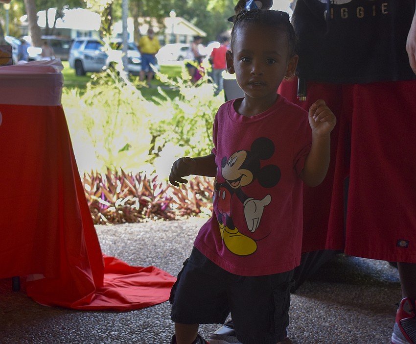Mason Mccullough, 2, dances to the tunes played by the DJ.