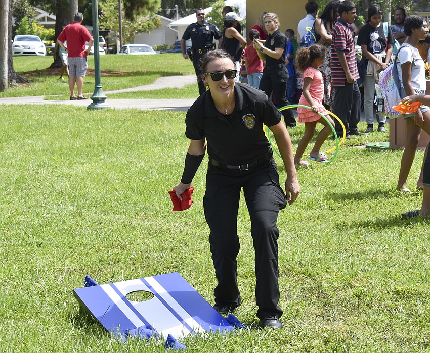 Rachael Ward faces off against Dearron Hargrove in cornhole.