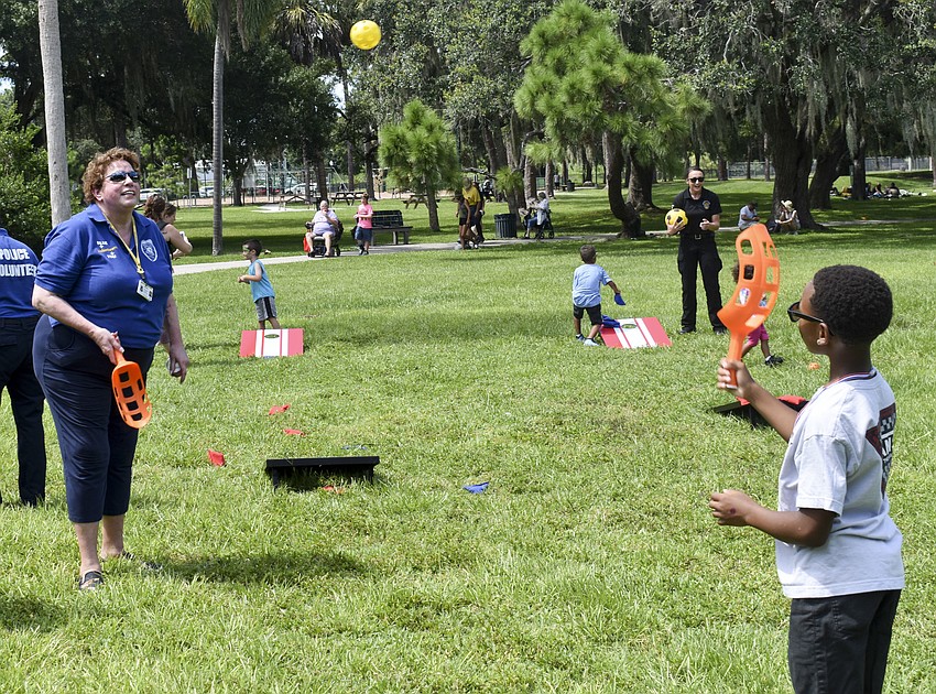 Sharon Coleman and Octavius Edwards join in a game of scoop ball.