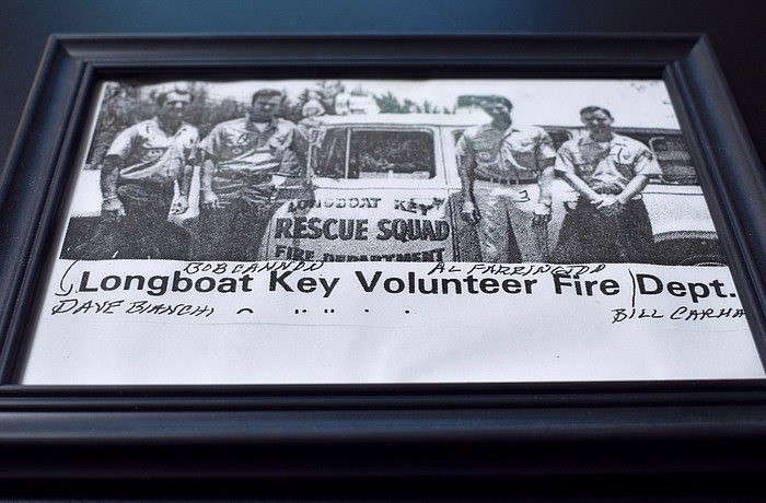 A photo of former Longboat firefighters in front of a long-gone truck.