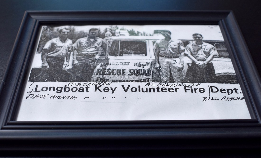 A photo of former Longboat firefighters in front of a long-gone truck.