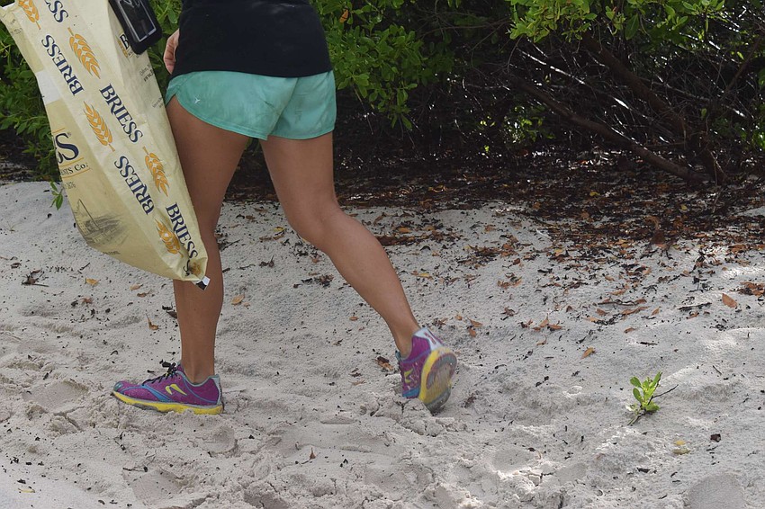 Stacy Mazza hunts for her next piece of trash.