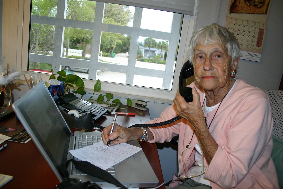 Dora Walters on duty in the Longboat Observer newsroom.