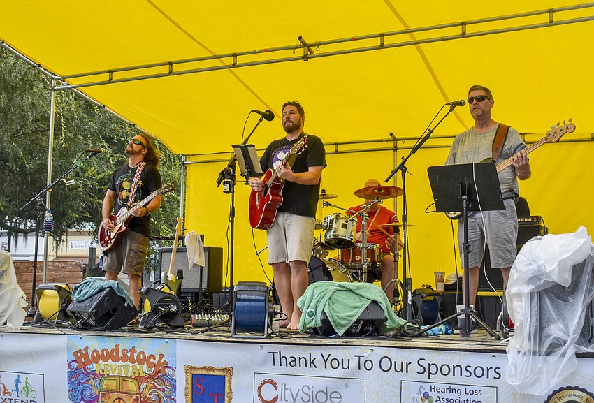 Kettle of Fish perform through the rain.