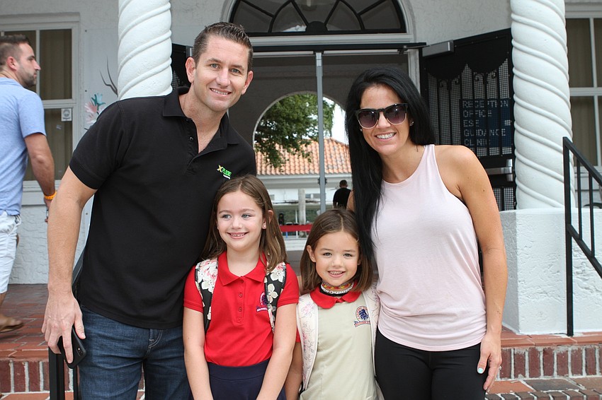 Brock, Scarlett, Kinley and Michelle Gratton prepare themselves for the first day of school at Southside Elementary. // Harry Sayer
