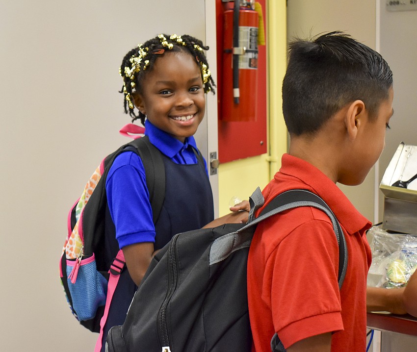 Debora Jean waits in line for breakfast on her first day of third grade. // Whitney Elfstrom