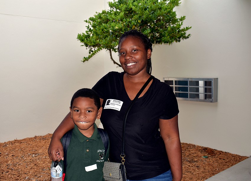 First grader Dakota Harvey and Shakiera Harvey poses for a picture before heading off to class at Alta Vista Elementary School. // Brynn Mechem