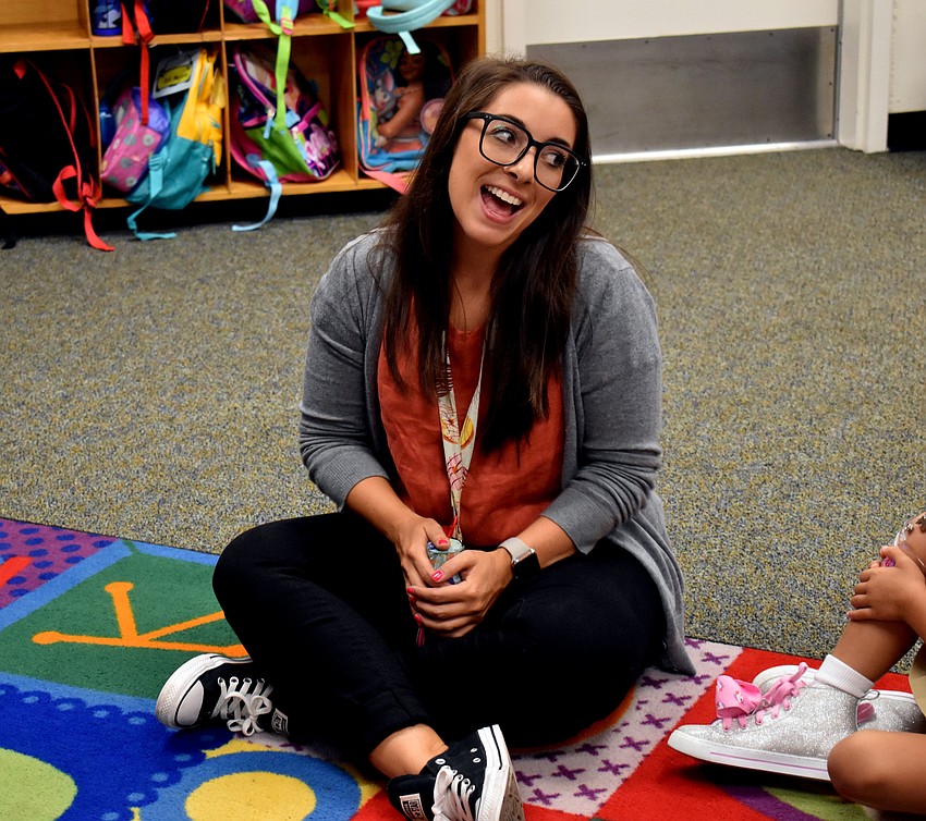 Alta Vista Elementary kindergarten teacher Alyssa Haven is all smiles as she welcomes students into their first day of school. // Brynn Mechem