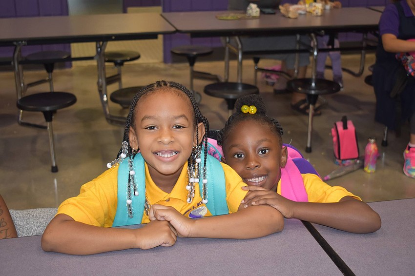 First graders Serenity Carter and Genesis Williams smile for the first day at Emma E. Booker Elementary. // Nathalie Kaemmerer