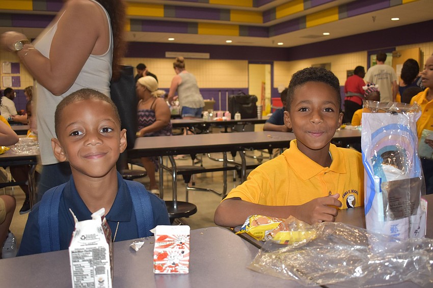 Major Wynan and Romelo Salem fuel up before school at Emma E. Booker Elementary. // Nathalie Kaemmerer