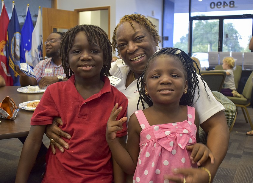 Ishmel Dumbar, 7, and Autumn Clarke, 4, hang out with their grandma Janet McBride.