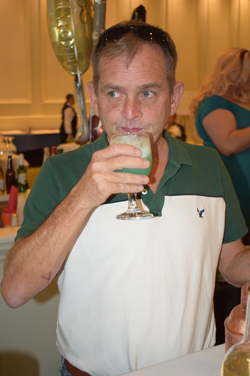 Celebrity bartender Brian Kehoe tests his own special cocktail, the Toiletbowl.