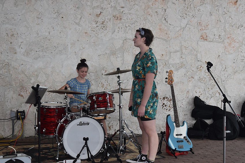 Maya and Nicole Taylor warm up before their musical performance.