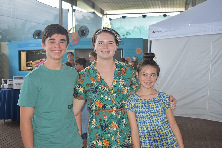 Michael, Nicole and Maya Taylor grin after a successful musical set.