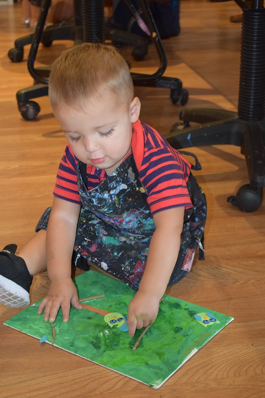 Sarasota 15-month-old Brandon Scott  does his best artwork on the floor.