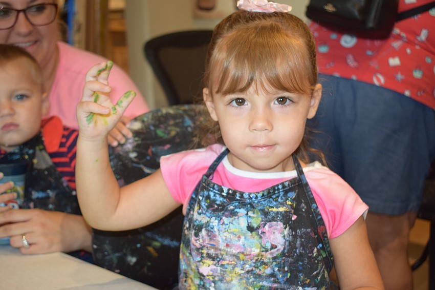 Sarasota 2-year-old Brooke Scott doesn't mind getting a little messy.