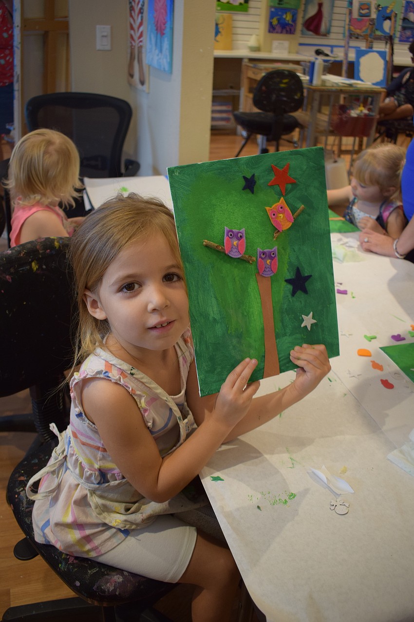 Sarasota 3-year-old Elena Collin shows her finished work of art.