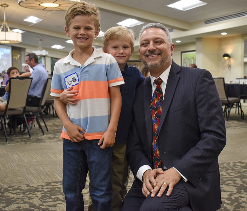 Drew and Jack Levine pose with Rabbi Michael Shefrin