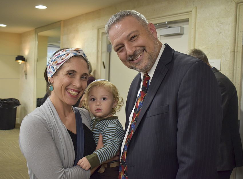 Rabbi Michael Shefrin with his wife Shayna and their baby, Jacob.