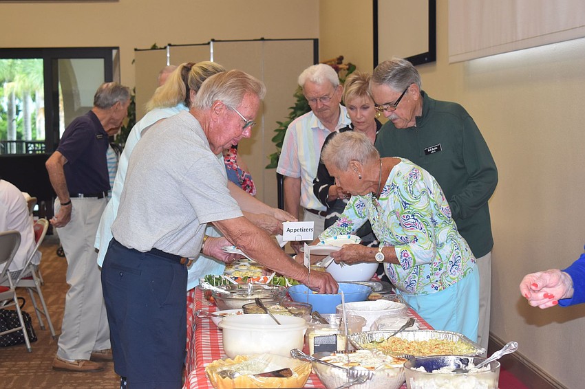Before the fish was served, attendees loaded up plates with appetizers.