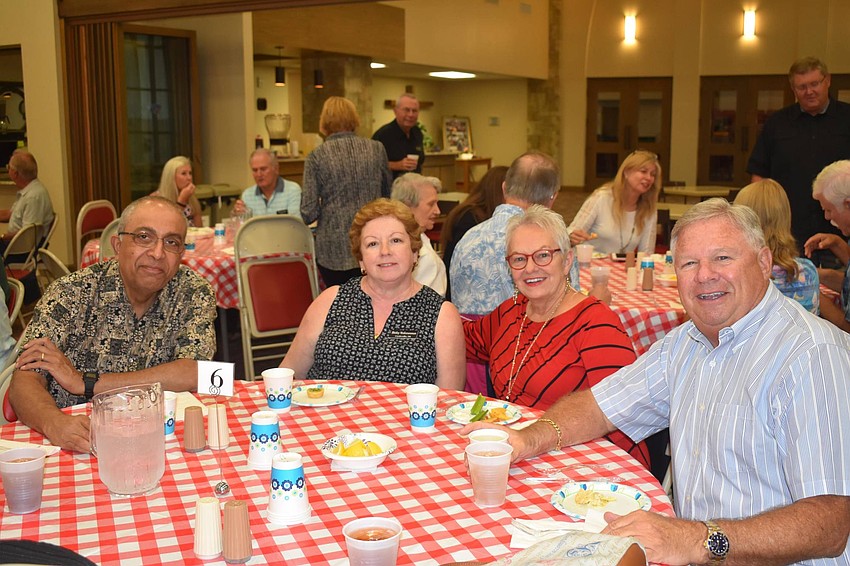 Ravi and Shirley Venkataraman sat with Holly and Fred Finks at the fish fry.