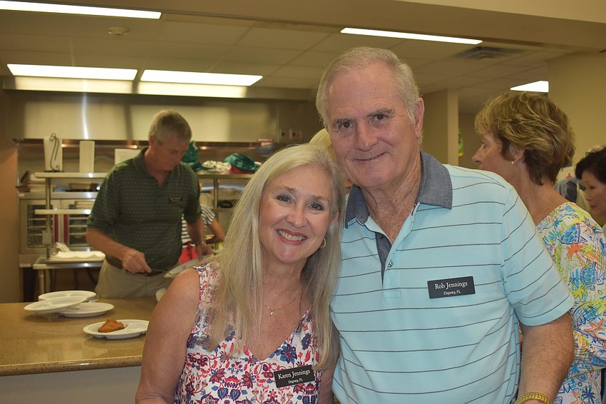 Karen and Rob Jennings wait in line for their turn for food.