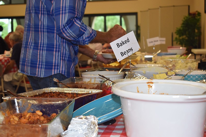 Kirt Bopp goes back for seconds on the plentiful table.