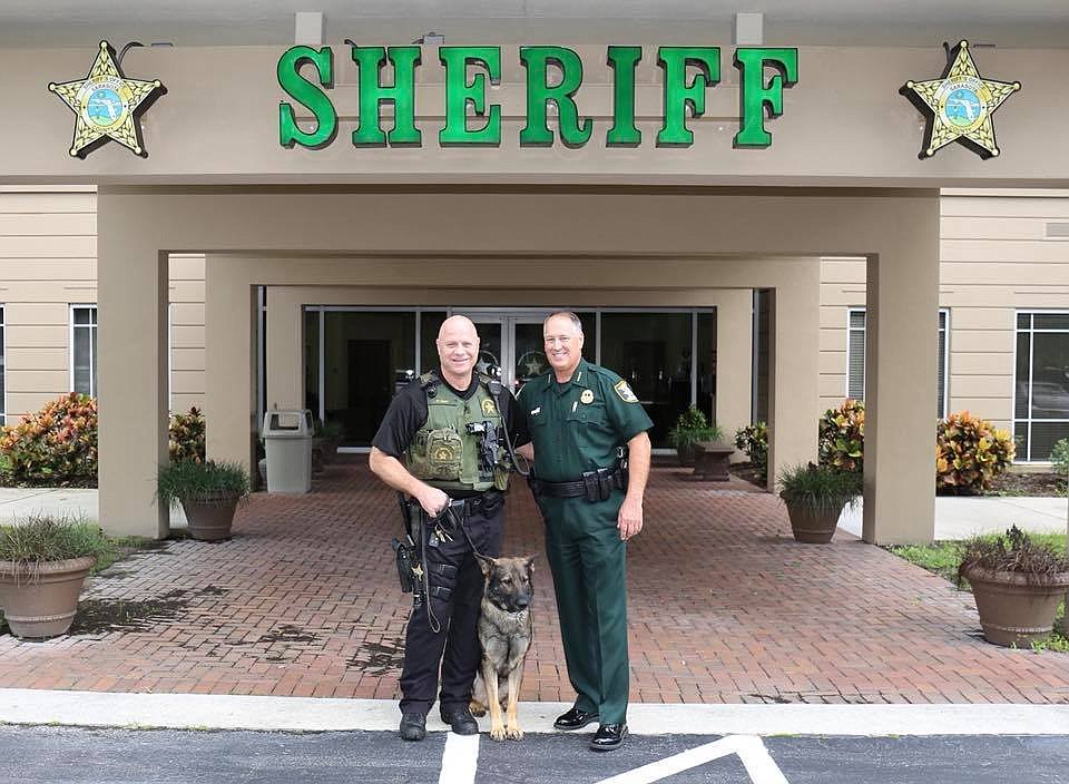 Paul Fern poses for a photo with his K-9, Eros, and Sheriff Tom Knight on his last day of duty in 2018. Photo Courtesy Sarasota County Sheriff&#39;s Office