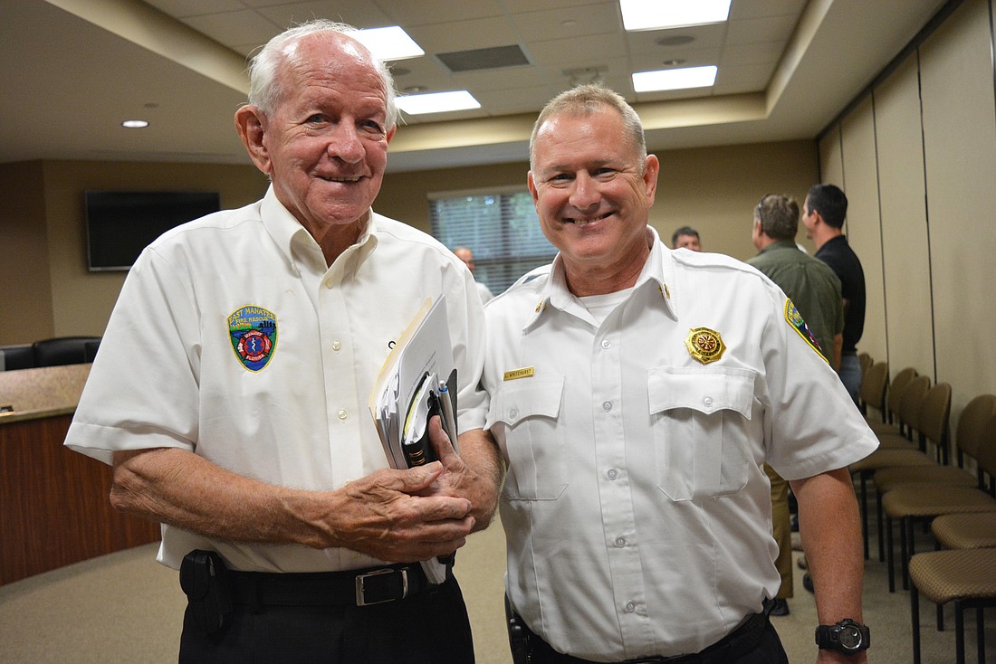 Don O&#39;Leary chats with East Manatee Fire Rescue Chief Lee Whitehurst after finishing his last meeting. Whitehurst said O&#39;Leary  will challenge you to get something done if he feels it is=s important.