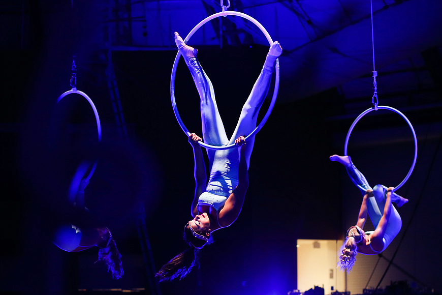 Performers with the Circus Arts Conservatory perform aerial Lyra. File Photo
