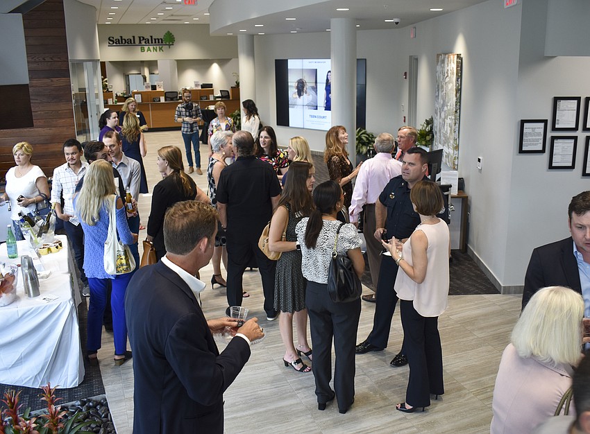 Guests of Teen Court's first-ever Sip n' Share Social mingle at Sabal Palm Bank.