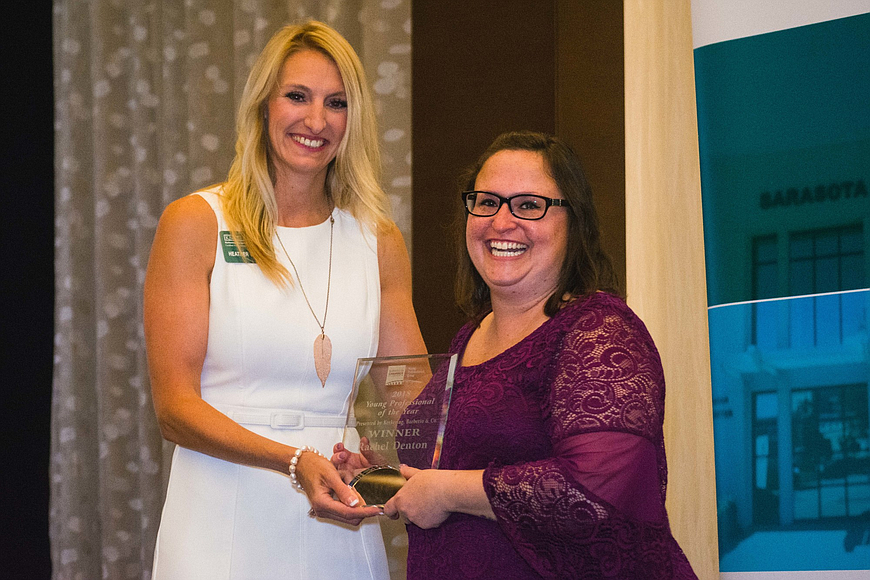 Heather Williams awards the 2018 Young Professional of the Year award to Rachel Denton, the communications and voter outreach manager at the Sarasota County Supervisor of Elections.