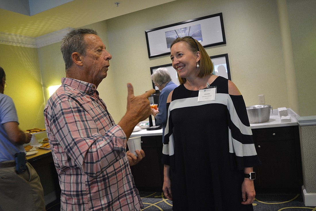 Mote Ranch&#39;s Frank English talks about nature with Conservation Foundation of the Gulf Coast President Christine Johnson before the start of the Aug. 14 community workshop at the Courtyard by Marriott at University Town Center.